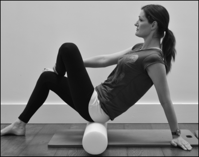 Using a foam roller to release muscle tension in your gluteal muscles