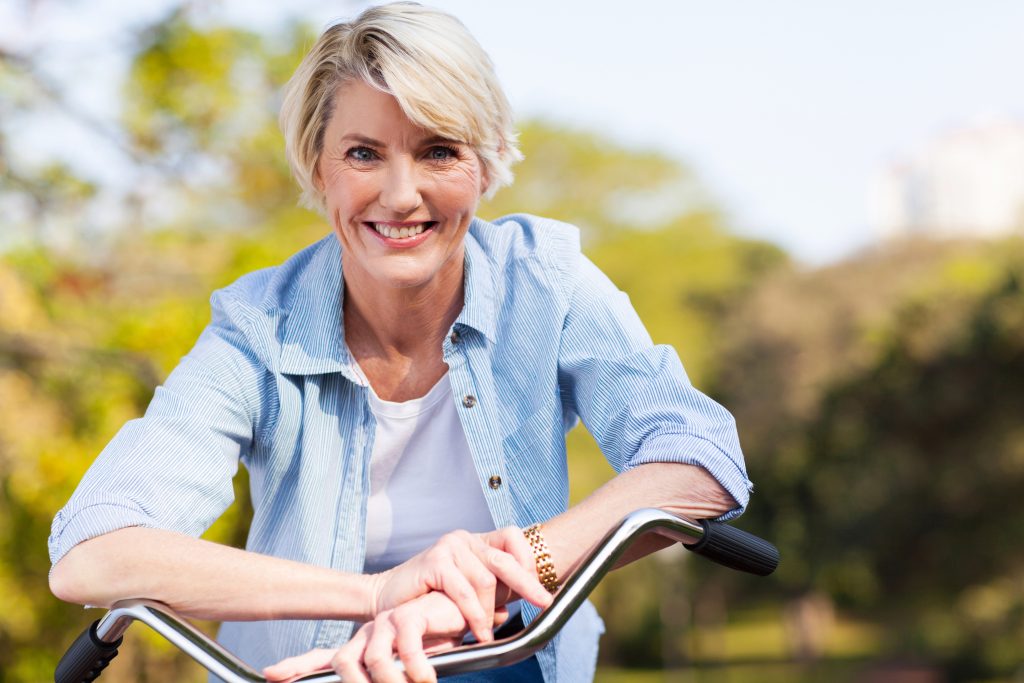 woman with healthy hips on a bike