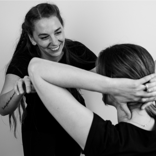 pilates instruction helping patient with osteoporosis
