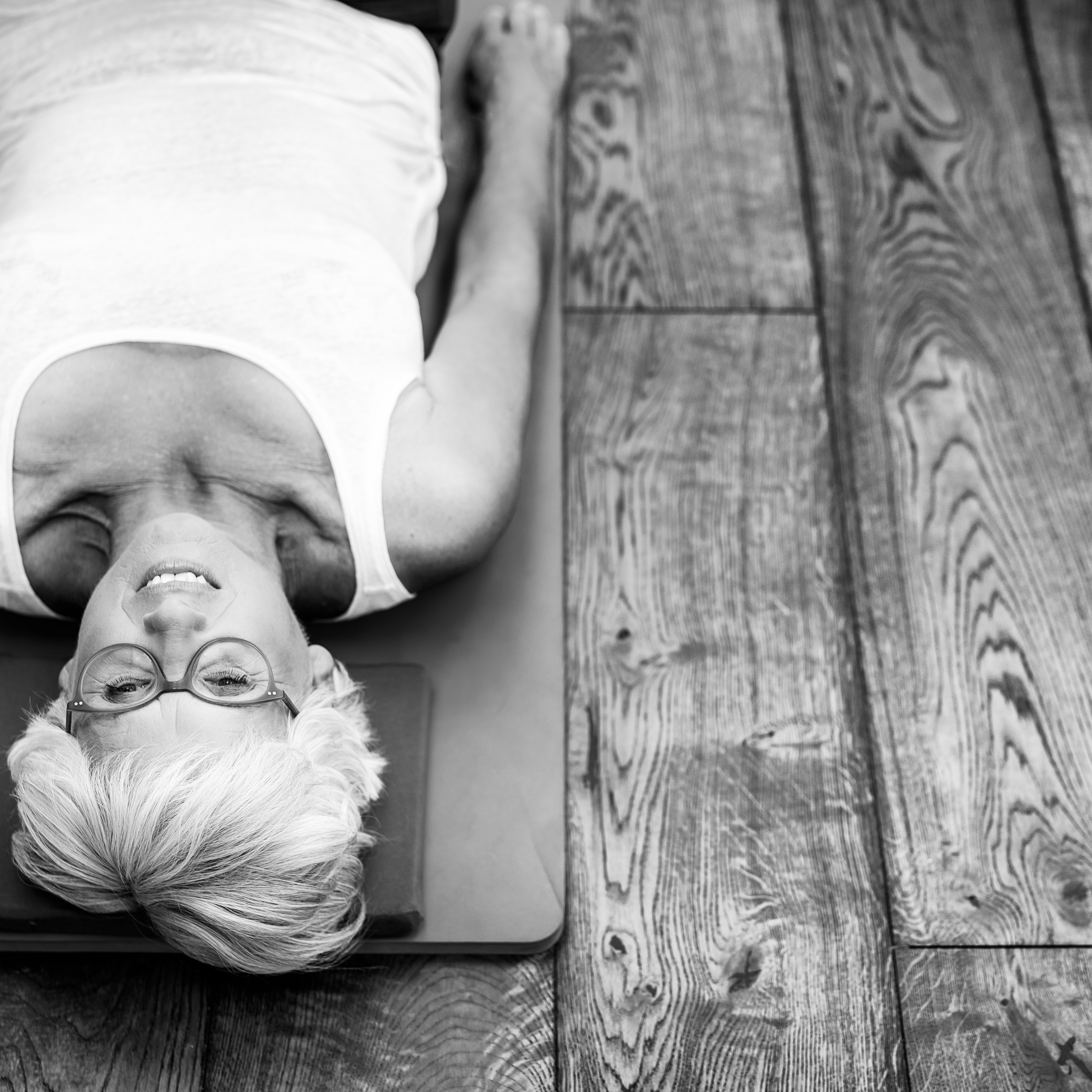 older adult doing a pilates class to help with arthritis osteoporosis